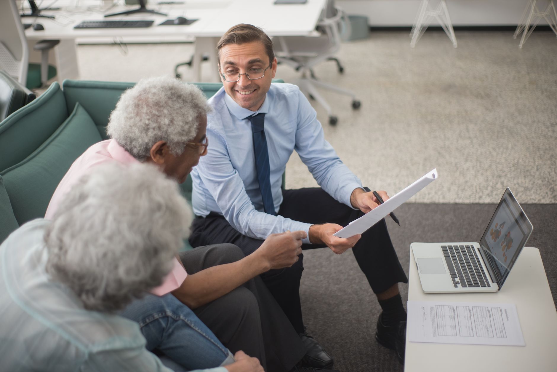 A financial advisor reviewing a plan with clients