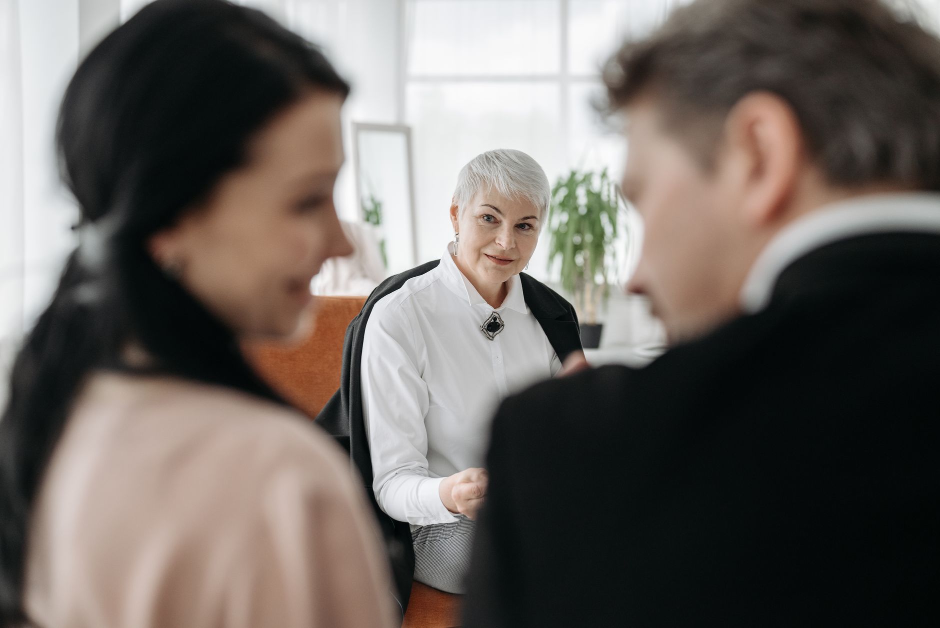 A financial advisor meeting a couple for a consultation