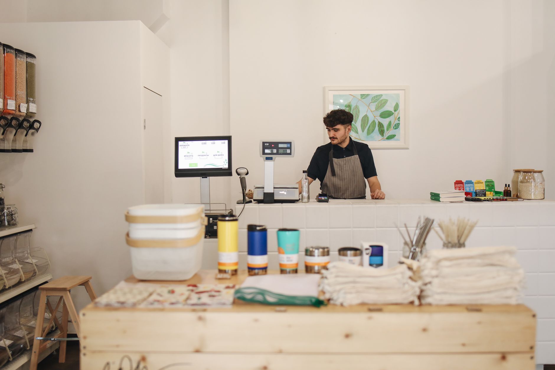 A franchise location owner running the front counter