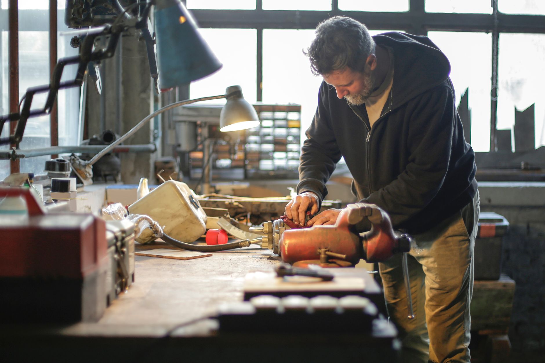 A garage door professional working in the shop