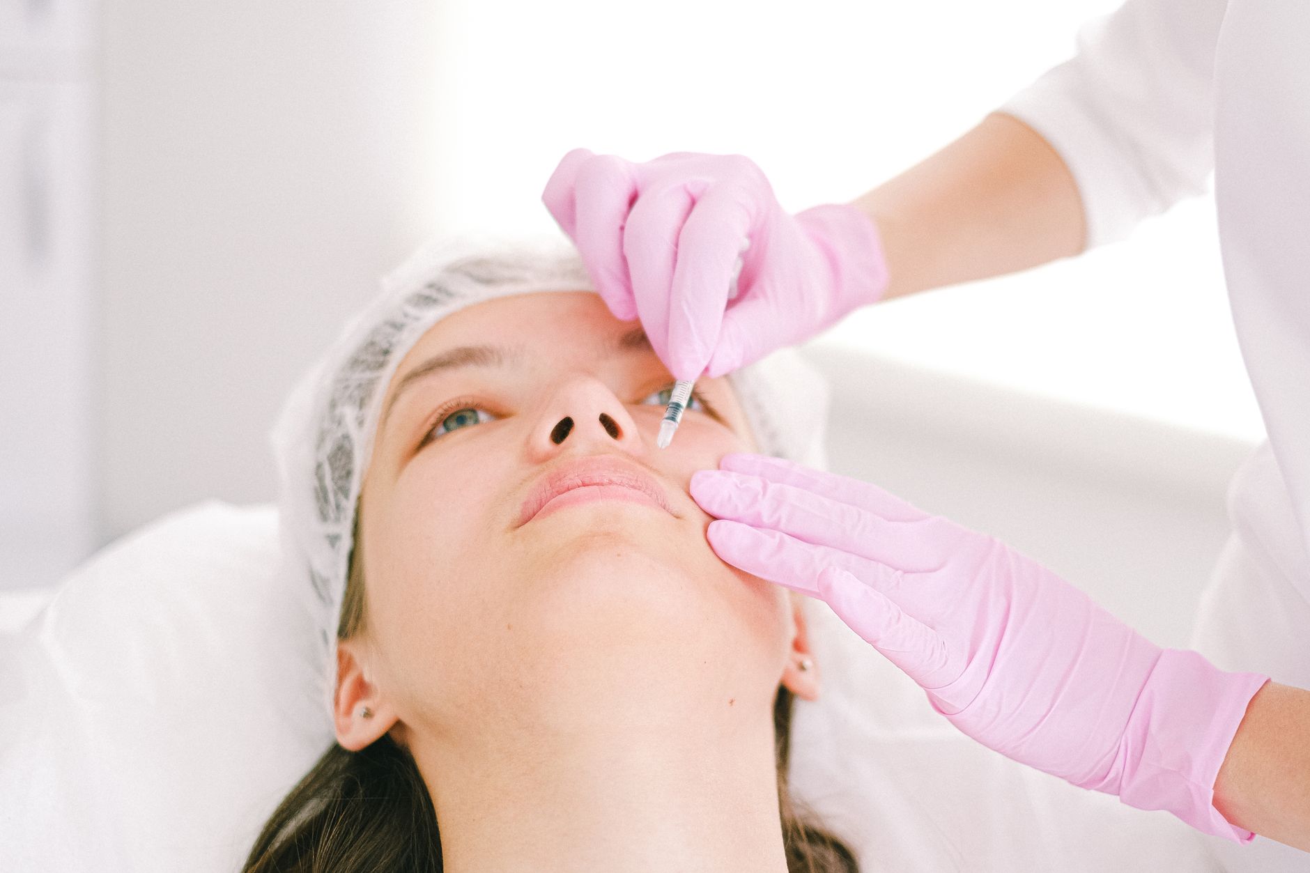 A med spa provider performing a cosmetic treatment