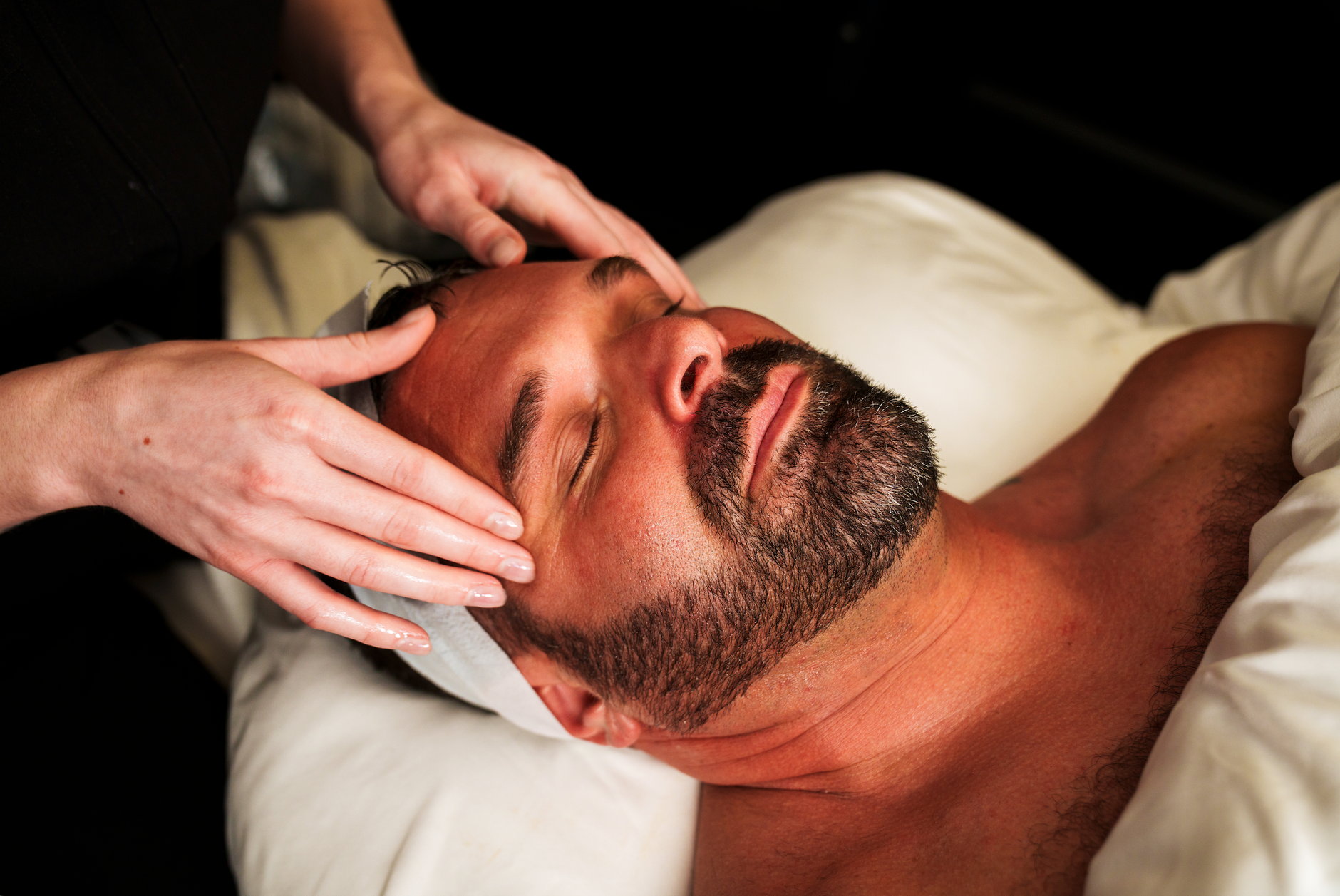 A client relaxing during a facial treatment at a med spa