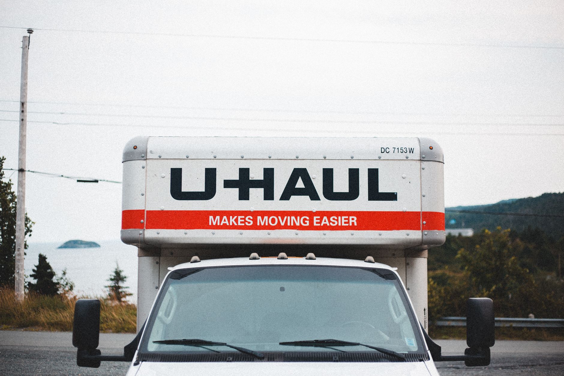 A moving truck parked outside, ready for the next job
