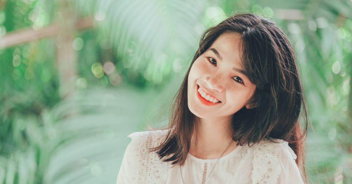 A teenager smiling confidently with a fresh set of braces