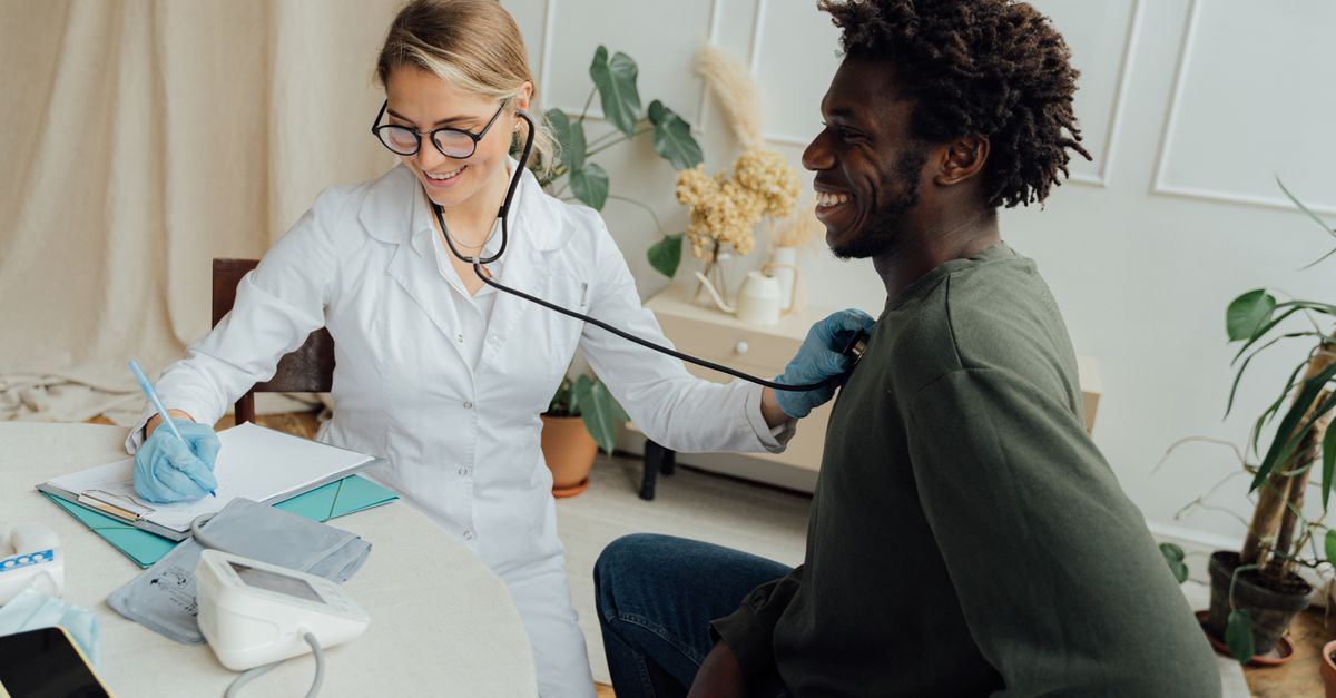 A relaxed, confident patient smiling during a follow up consultation after a procedure