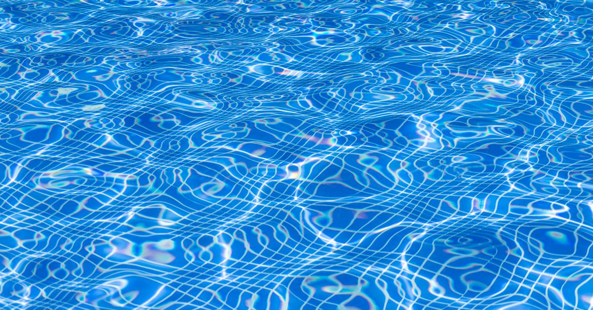 A sparkling, freshly serviced backyard pool ready for a family to swim